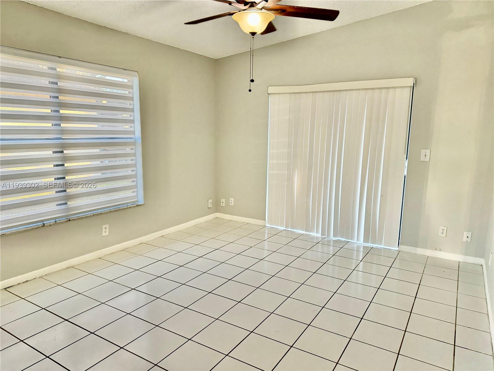 3370 Beau Rivage Drive, Unit 1R Pompano Beach, FL 33064 - Photo 13 of 15 a view of a room and window