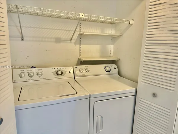 a utility room with dryer and washer