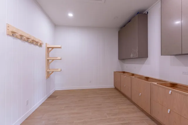 a view of a kitchen with a sink and cabinets
