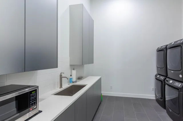 a view of a kitchen from the sink