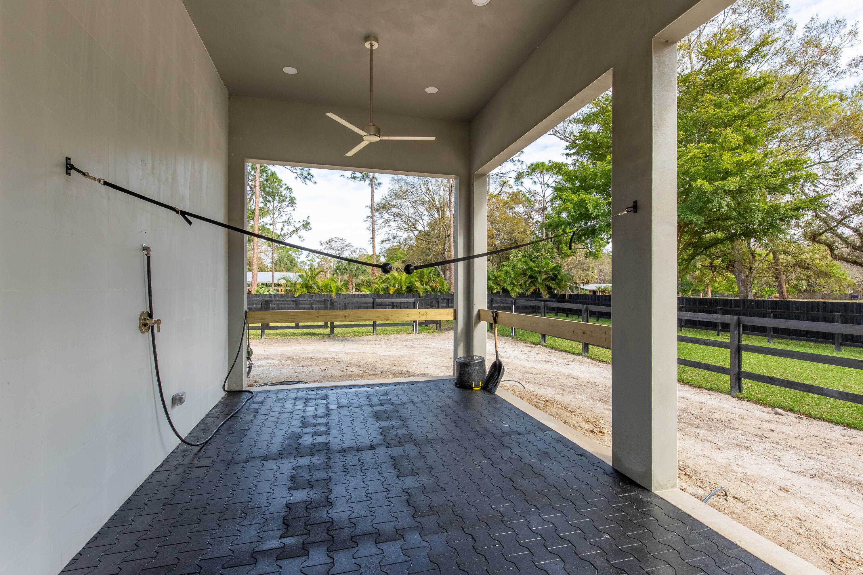 14717 Collecting Canal Road Loxahatchee Groves, FL 33470 - Photo 18 of 27 a view of a porch with wooden floor and fence