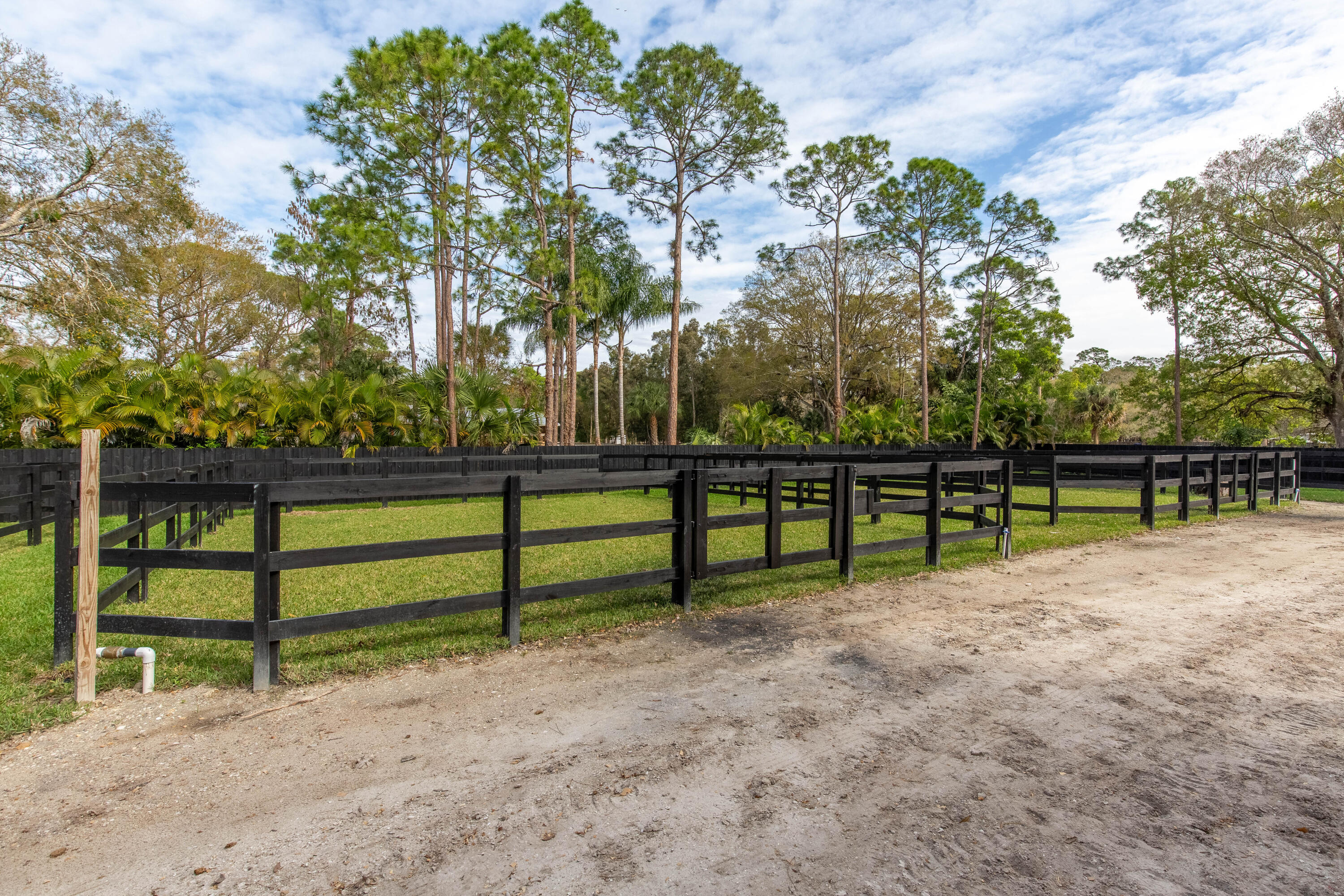 14717 Collecting Canal Road Loxahatchee Groves, FL 33470 - Photo 19 of 27 a view of park with wooden fence
