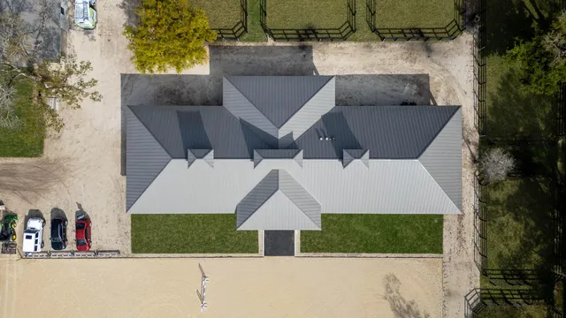 an aerial view of a house with entertaining space