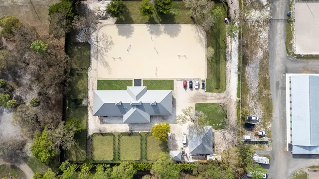 an aerial view of a house with yard swimming pool and outdoor seating
