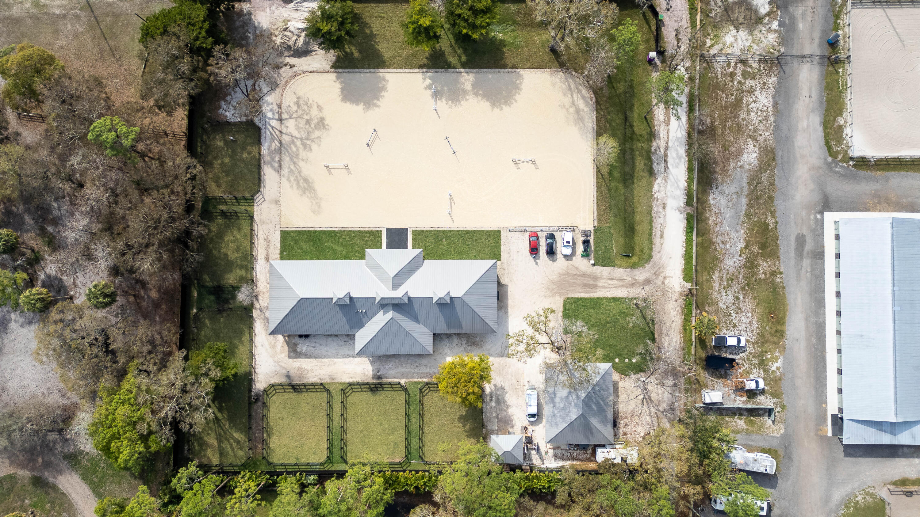 14717 Collecting Canal Road Loxahatchee Groves, FL 33470 - Photo 26 of 27 an aerial view of a house with yard swimming pool and outdoor seating