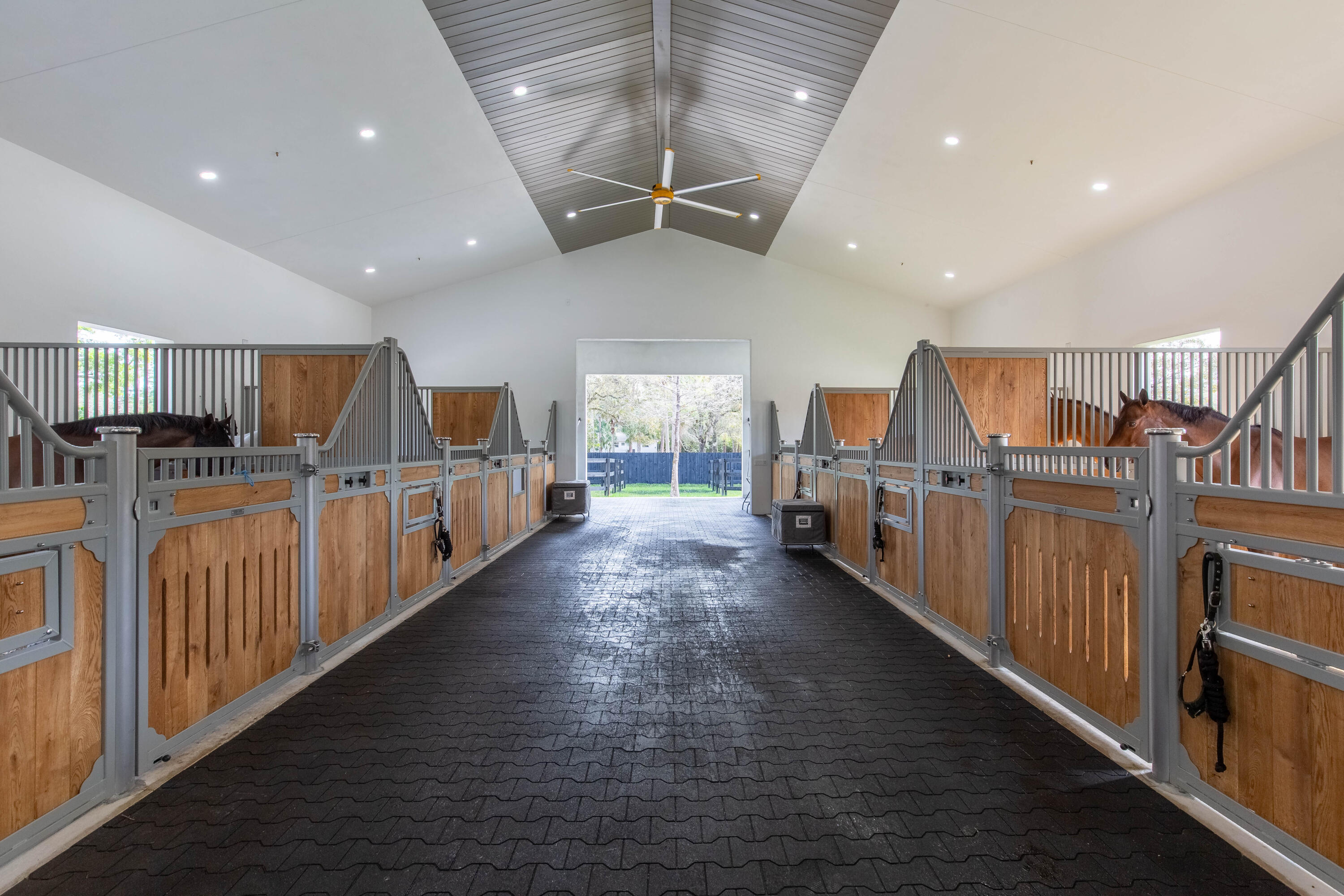 14717 Collecting Canal Road Loxahatchee Groves, FL 33470 - Photo 6 of 27 a large room with lots of wooden furniture and a rug