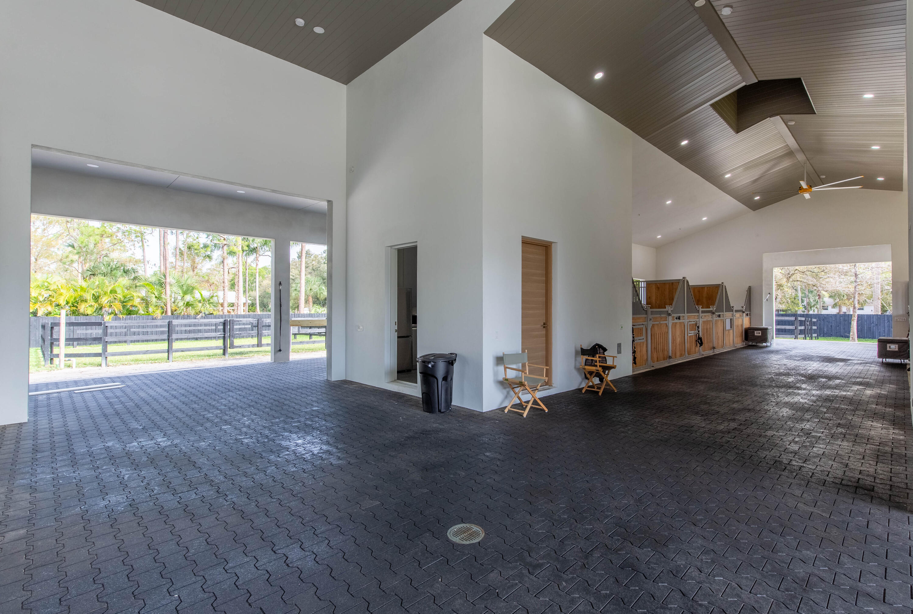14717 Collecting Canal Road Loxahatchee Groves, FL 33470 - Photo 8 of 27 an empty room with fireplace and windows