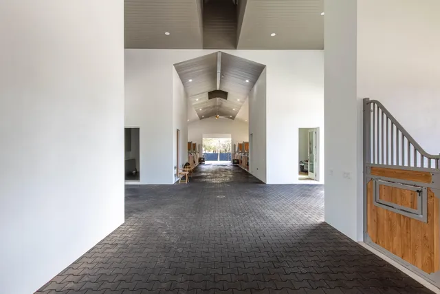 a view of living room with furniture and wooden floor