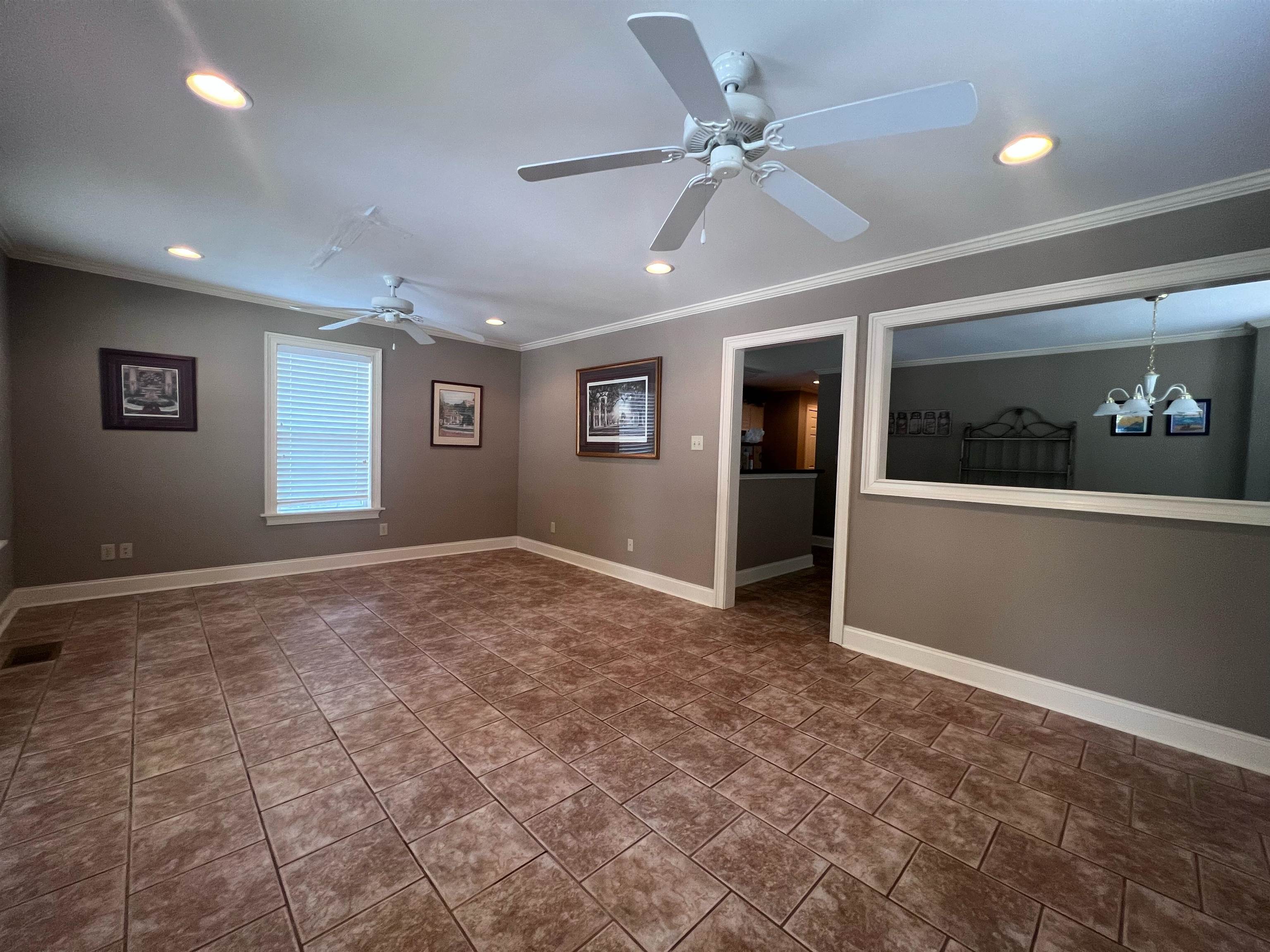 10 Patsy Path Iuka, MS 38852 - Photo 6 of 18 a view of a livingroom with a ceiling fan and window