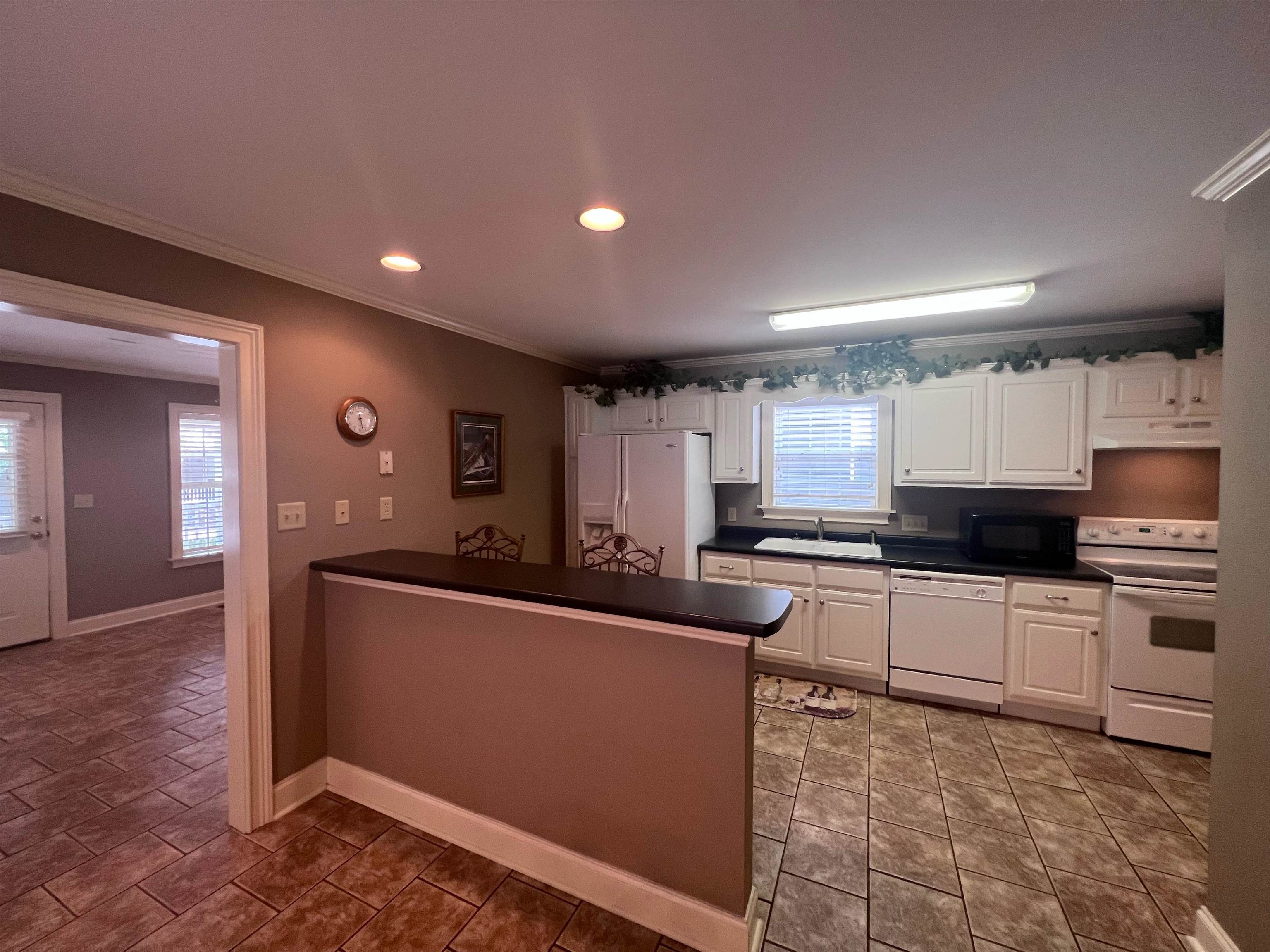 10 Patsy Path Iuka, MS 38852 - Photo 10 of 18 a kitchen with stainless steel appliances granite countertop a sink and cabinets