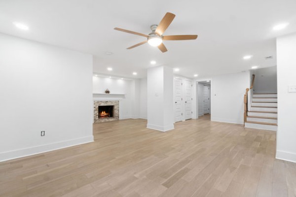 276 East Porters Bluff Road Clarksville, TN 37040 - Photo 11 of 41 an empty room with a ceiling fan and a fireplace
