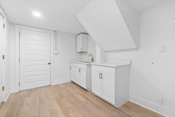 276 East Porters Bluff Road Clarksville, TN 37040 - Photo 14 of 41 a kitchen with white cabinets and white appliances
