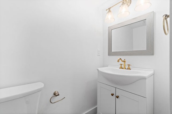 276 East Porters Bluff Road Clarksville, TN 37040 - Photo 15 of 41 a bathroom with a sink a toilet and mirror