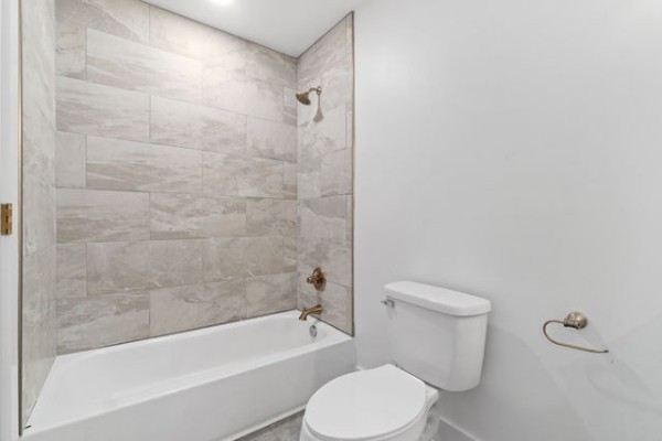 276 East Porters Bluff Road Clarksville, TN 37040 - Photo 24 of 41 a white toilet and tub sitting next to a bathroom sink