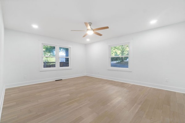276 East Porters Bluff Road Clarksville, TN 37040 - Photo 26 of 41 an empty room with windows and ceiling fan