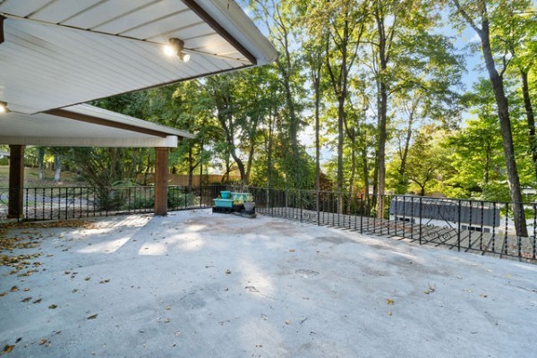 276 East Porters Bluff Road Clarksville, TN 37040 - Photo 33 of 41 a view of a backyard with large trees and wooden fence