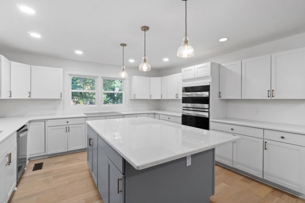 276 East Porters Bluff Road Clarksville, TN 37040 - Photo 4 of 41 a kitchen with a stove a sink a center island and windows