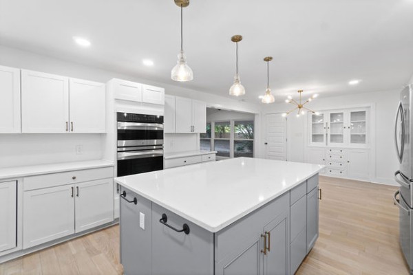276 East Porters Bluff Road Clarksville, TN 37040 - Photo 5 of 41 a kitchen with kitchen island white cabinets and refrigerator