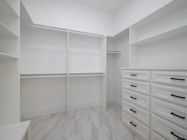 a view of an empty walk in closet
