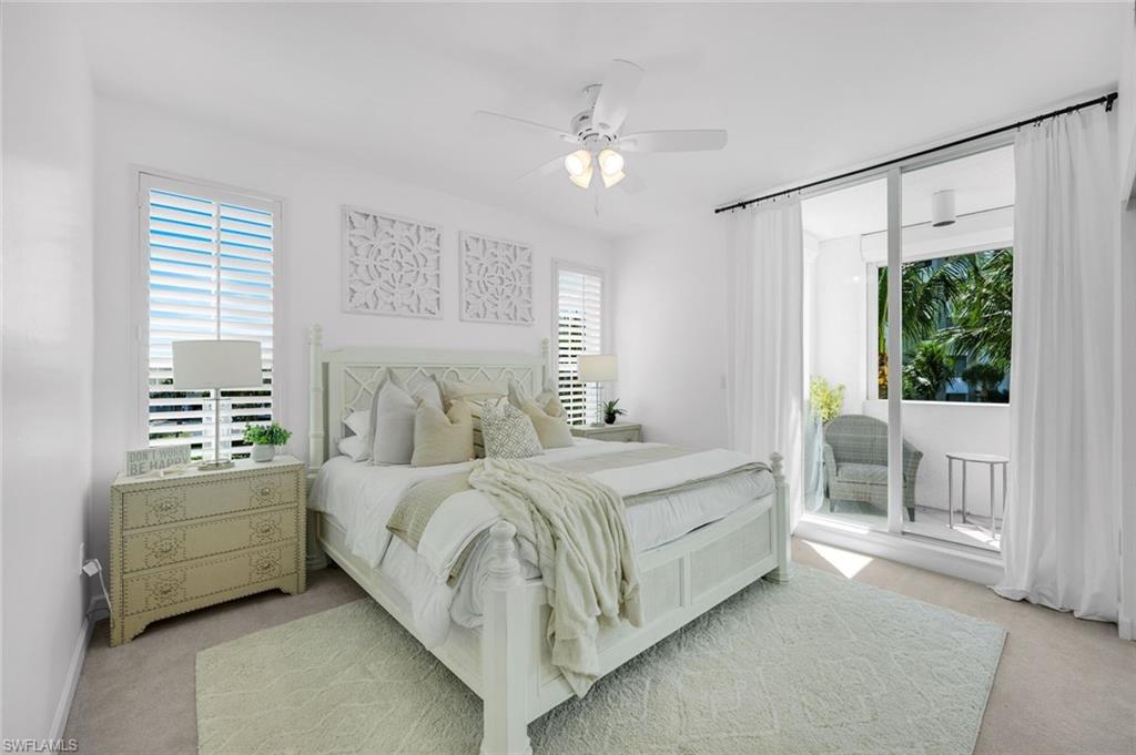 315 Dunes Boulevard, Unit 201 Naples, FL 34110 - Photo 13 of 30 a bed room with a bed and a window