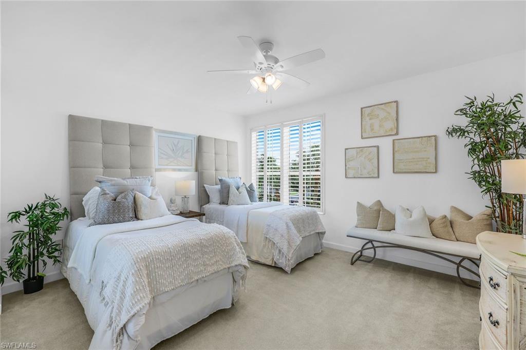 315 Dunes Boulevard, Unit 201 Naples, FL 34110 - Photo 15 of 30 a bedroom with two beds and potted plant