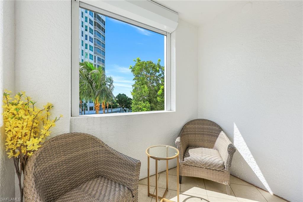 315 Dunes Boulevard, Unit 201 Naples, FL 34110 - Photo 17 of 30 a living room with furniture and a window