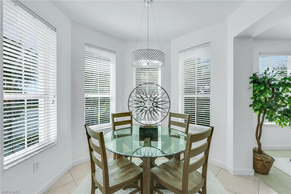 315 Dunes Boulevard, Unit 201 Naples, FL 34110 - Photo 2 of 30 a dining room with furniture and window
