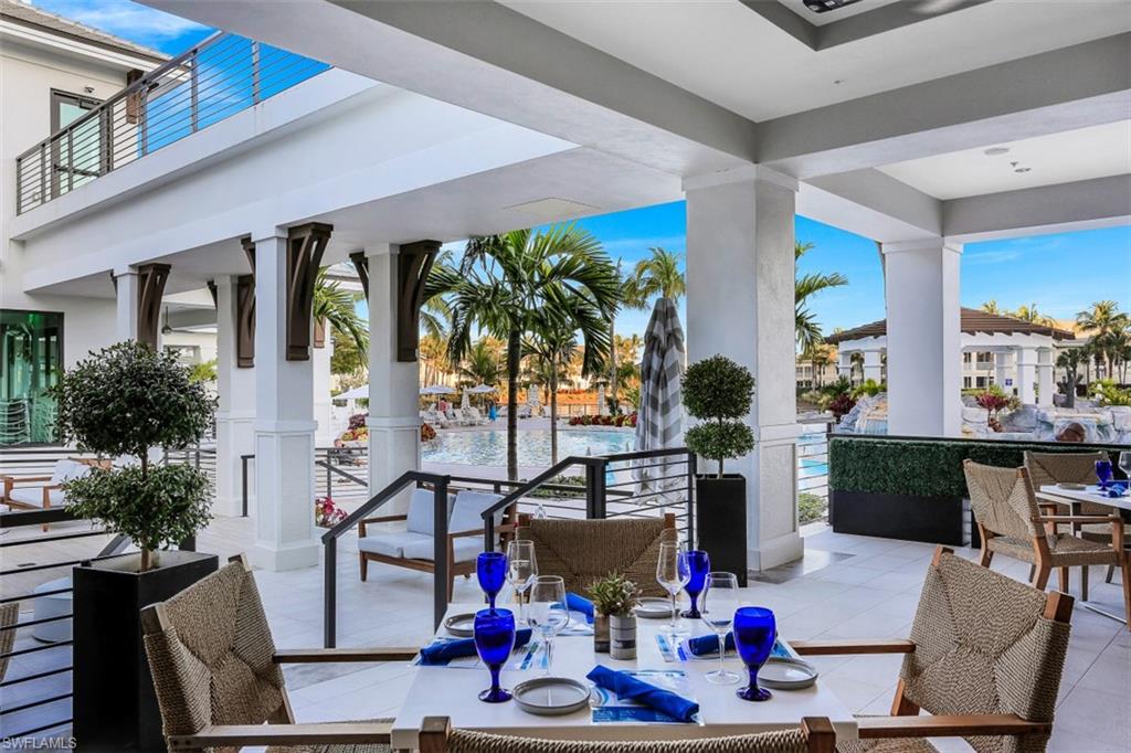 315 Dunes Boulevard, Unit 201 Naples, FL 34110 - Photo 23 of 30 a view of entryway livingroom and hall way with wooden floor