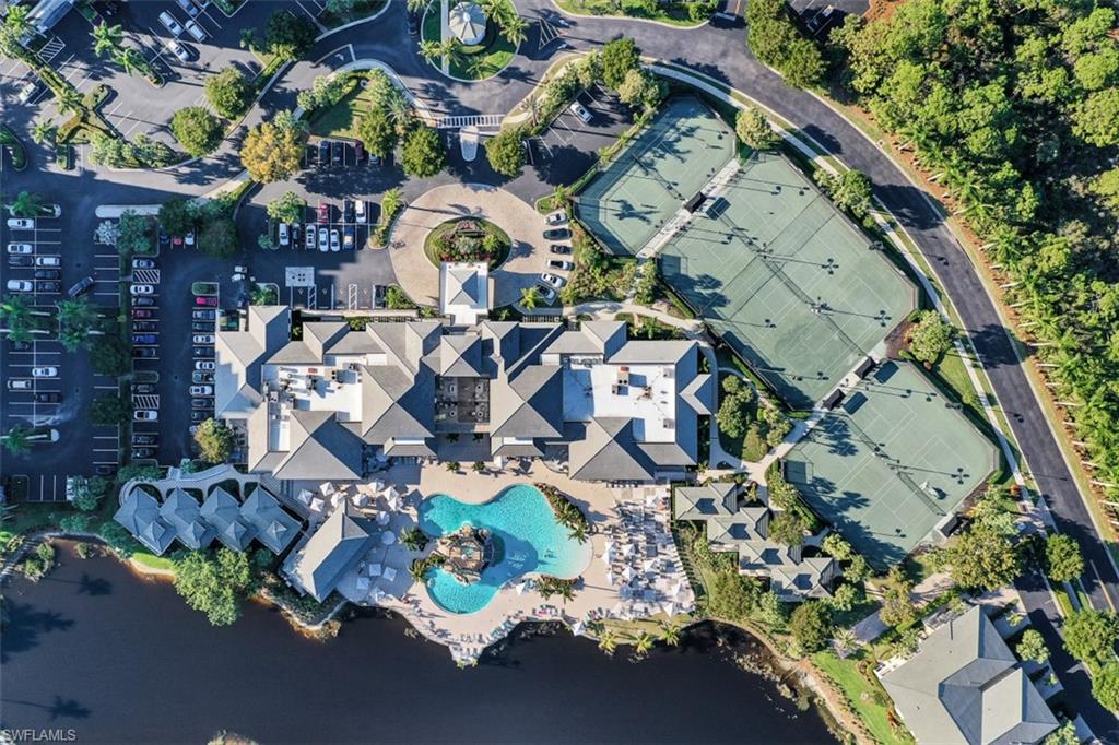 315 Dunes Boulevard, Unit 201 Naples, FL 34110 - Photo 24 of 30 an aerial view of a swimming pool patio and outdoor seating