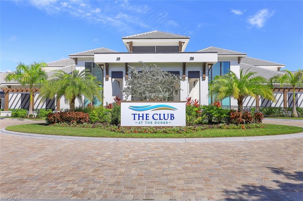 315 Dunes Boulevard, Unit 201 Naples, FL 34110 - Photo 30 of 30 a sign that is sitting in front of a house