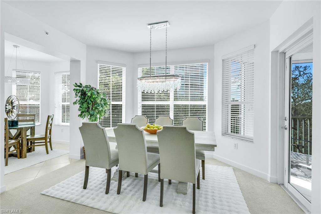 315 Dunes Boulevard, Unit 201 Naples, FL 34110 - Photo 3 of 30 a view of a dining room with furniture window and outside view