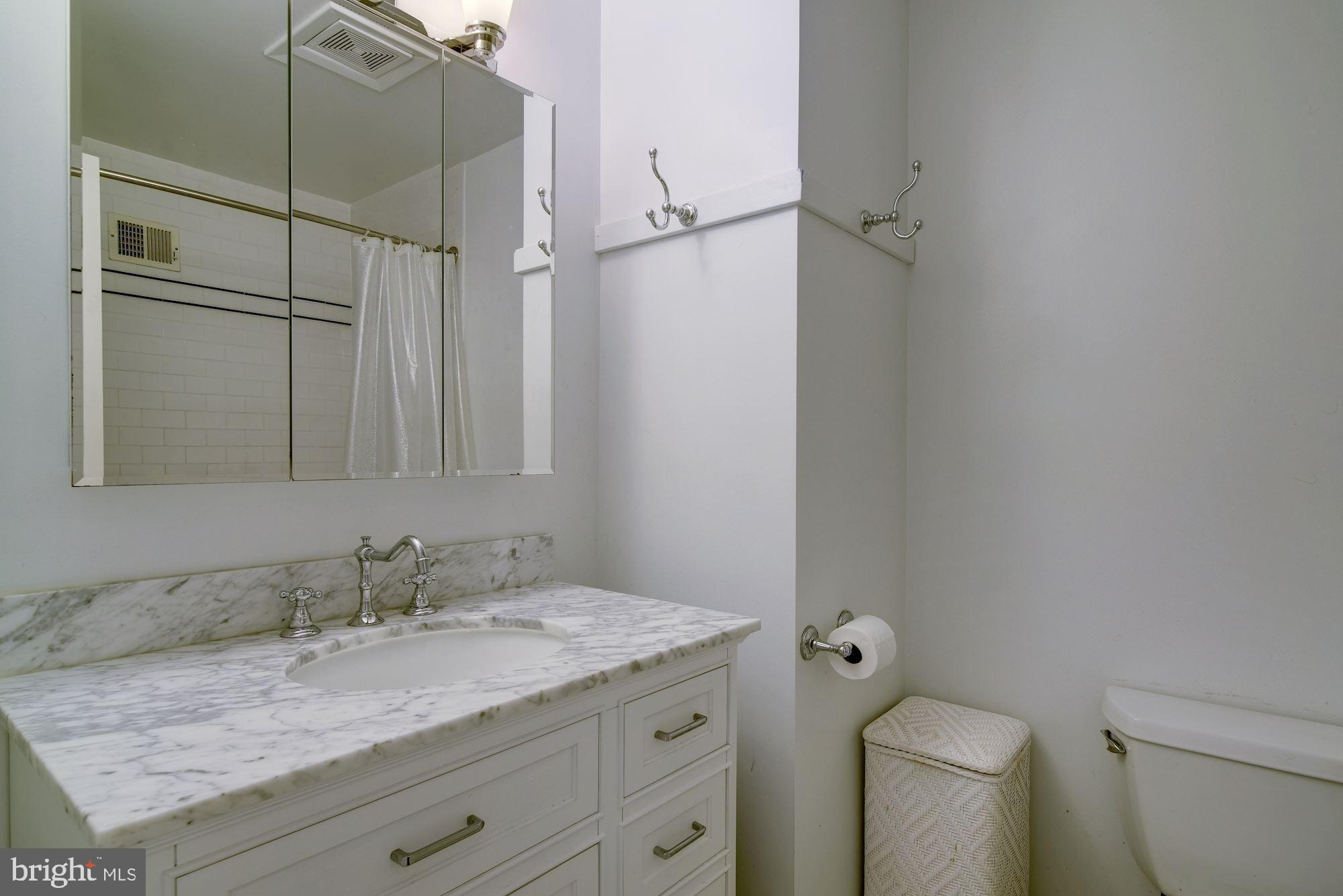 11821 Prestwick Road Potomac, MD 20854 - Photo 22 of 33 Updated Hall Bath with Marble Top Vanity