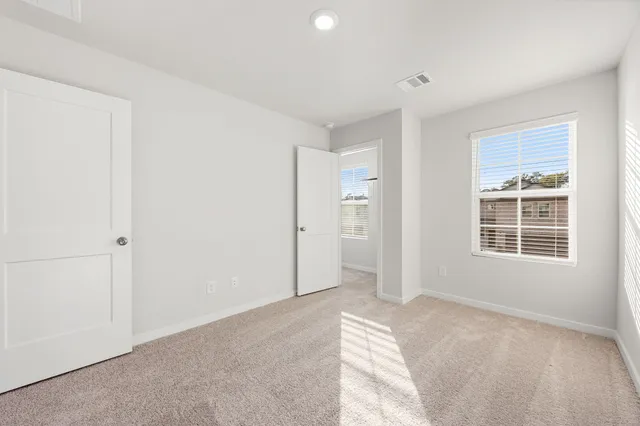 a view of entrance gate of house and yard