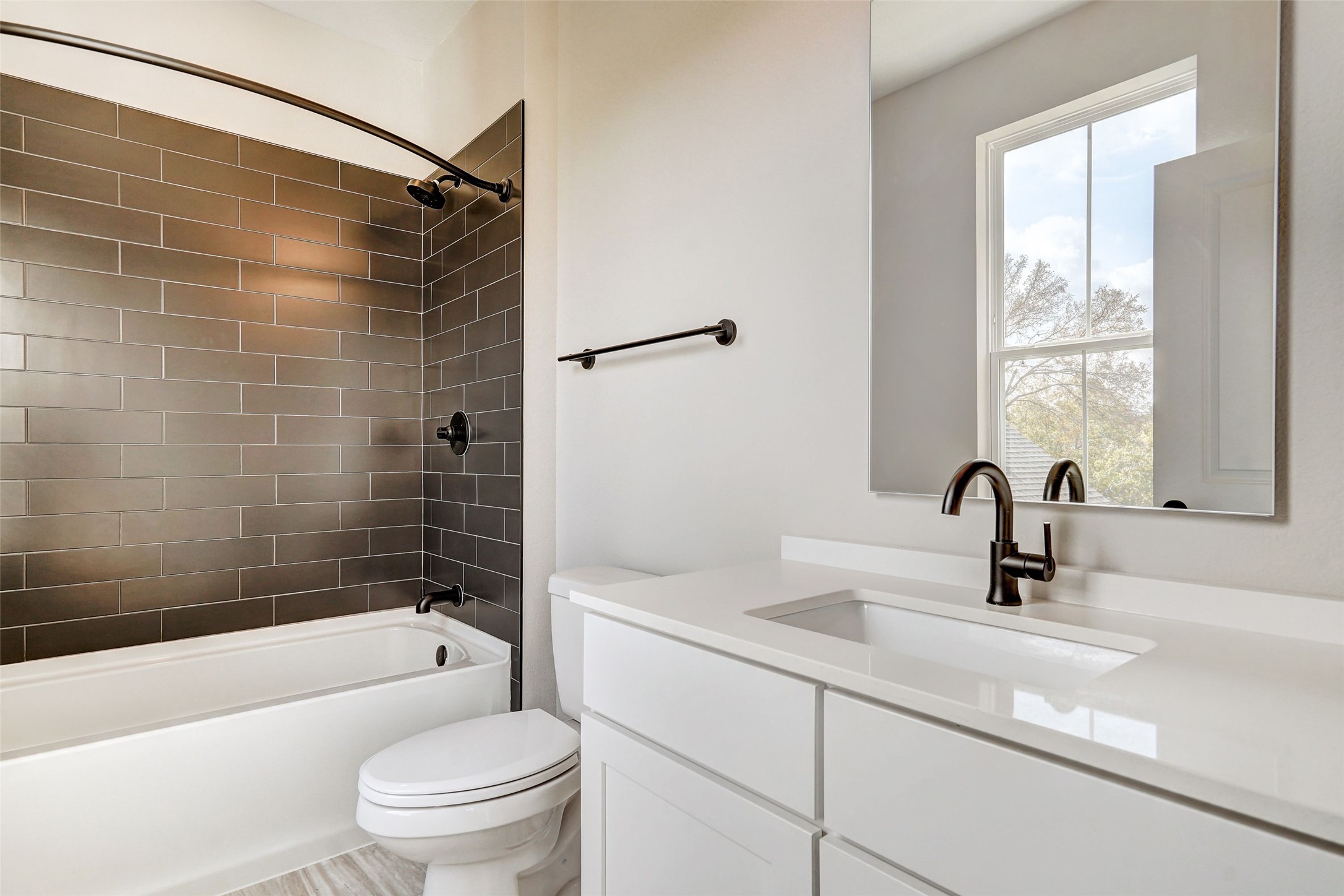 3809 Valley View Road, Unit 13 Austin, TX 78704 - Photo 13 of 27 a bathroom with a sink a toilet and shower