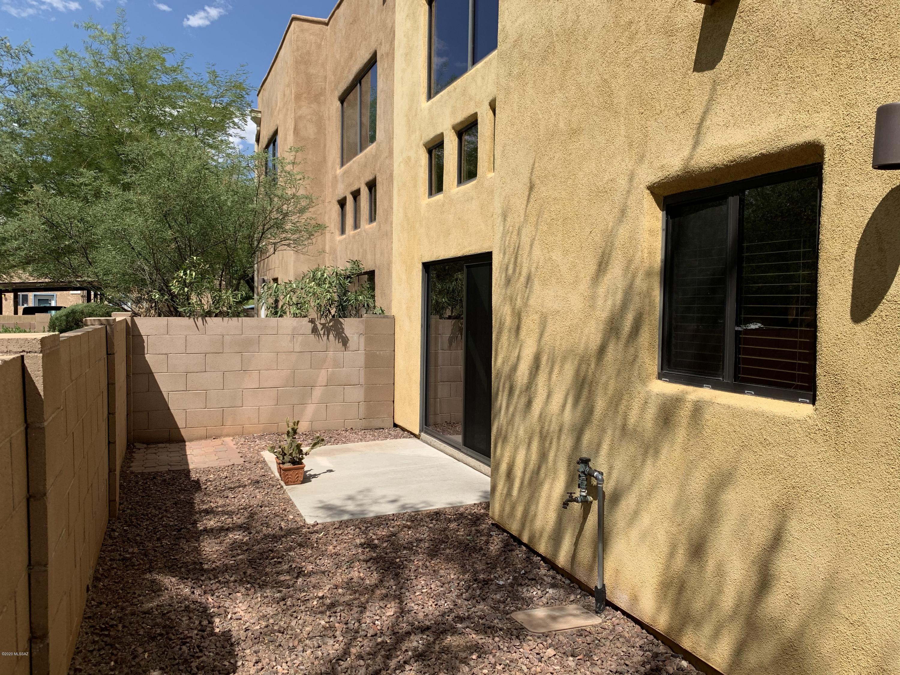 4181 North Fortune Loop Tucson, AZ 85719 - Photo 34 of 39 a view of a house with backyard and sitting area
