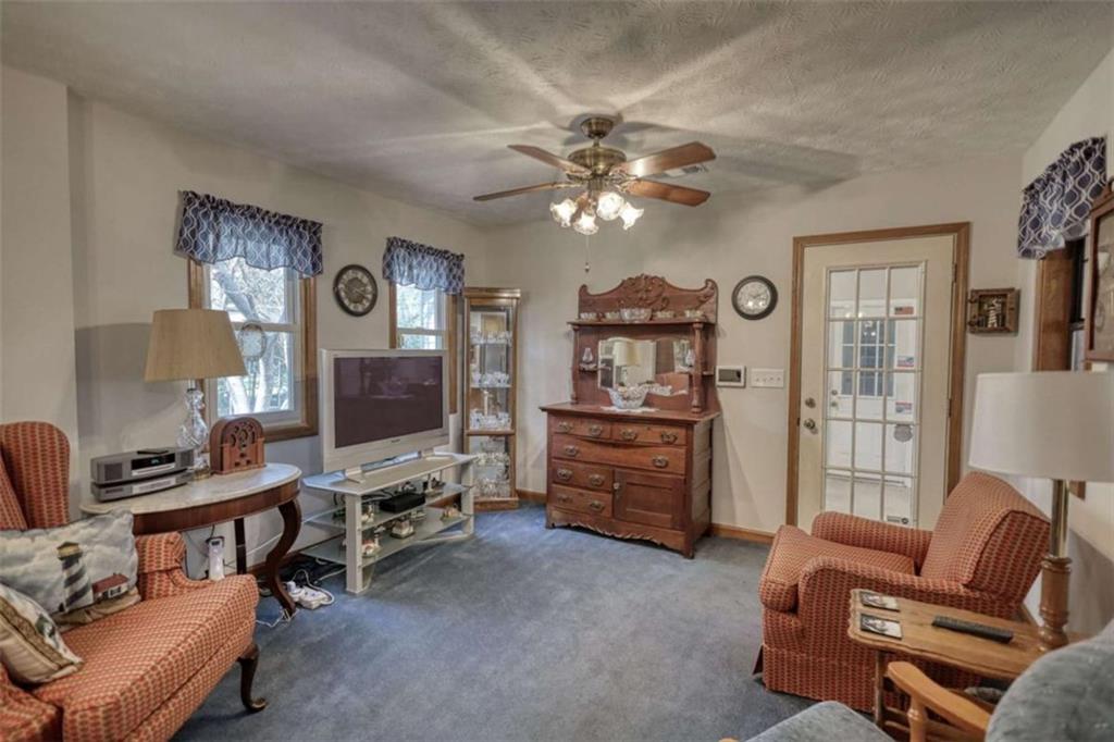 2740 Dennard Road Northeast Conyers, GA 30013 - Photo 10 of 51 a living room with furniture and a flat screen tv
