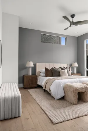 a bedroom with bed and a chandelier