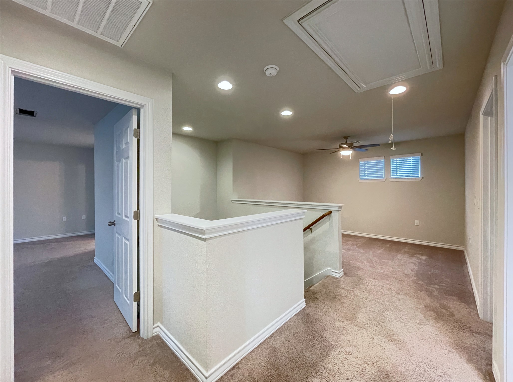 1602 Jacey Way Austin, TX 78725 - Photo 15 of 33 Carpeted upper-level landing with recessed lighting, a ceiling fan, and natural light from two windows with blinds