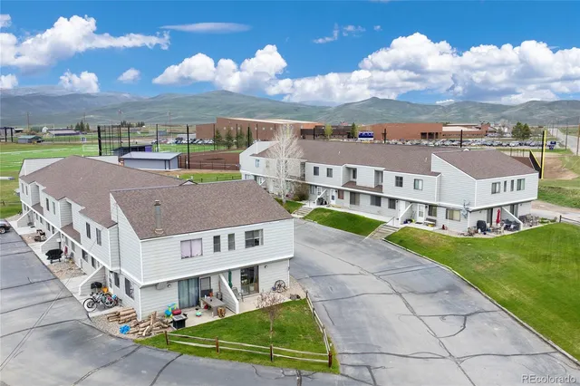 aerial view of a house with a yard