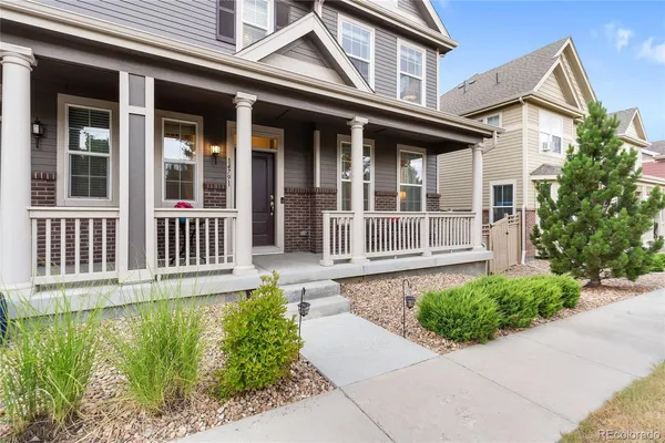 front view of a house with a small yard