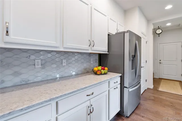a kitchen with stainless steel appliances a refrigerator and a sink