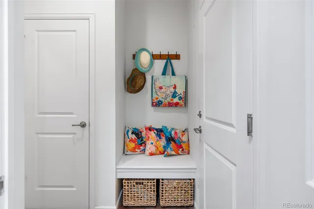 a white refrigerator freezer and a white wooden floor