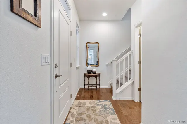 a view of entryway with wooden floor