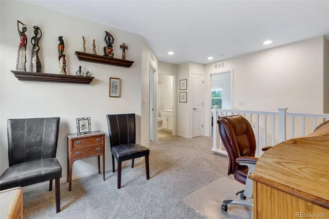 a view of a workspace with furniture and a couch