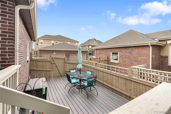 a view of a roof deck with furniture