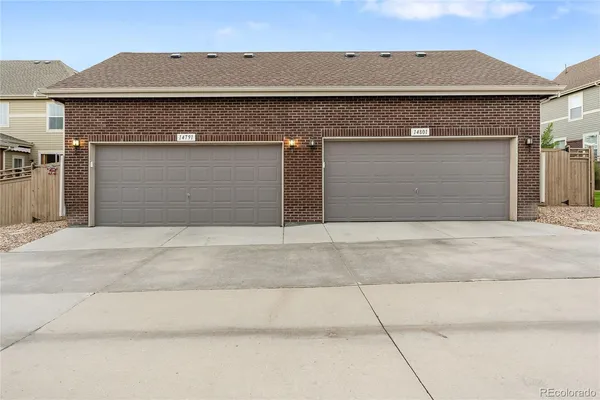 front view of a house with a small yard