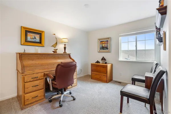 a room with furniture and a window