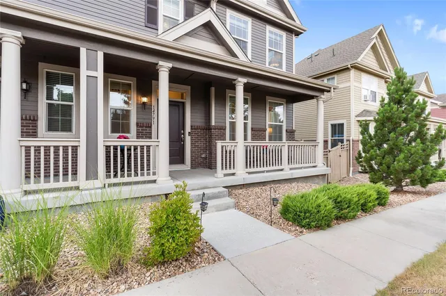 front view of a house with a small yard