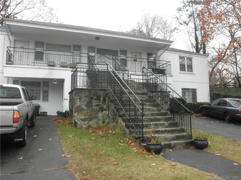 a view of a car park in front of house