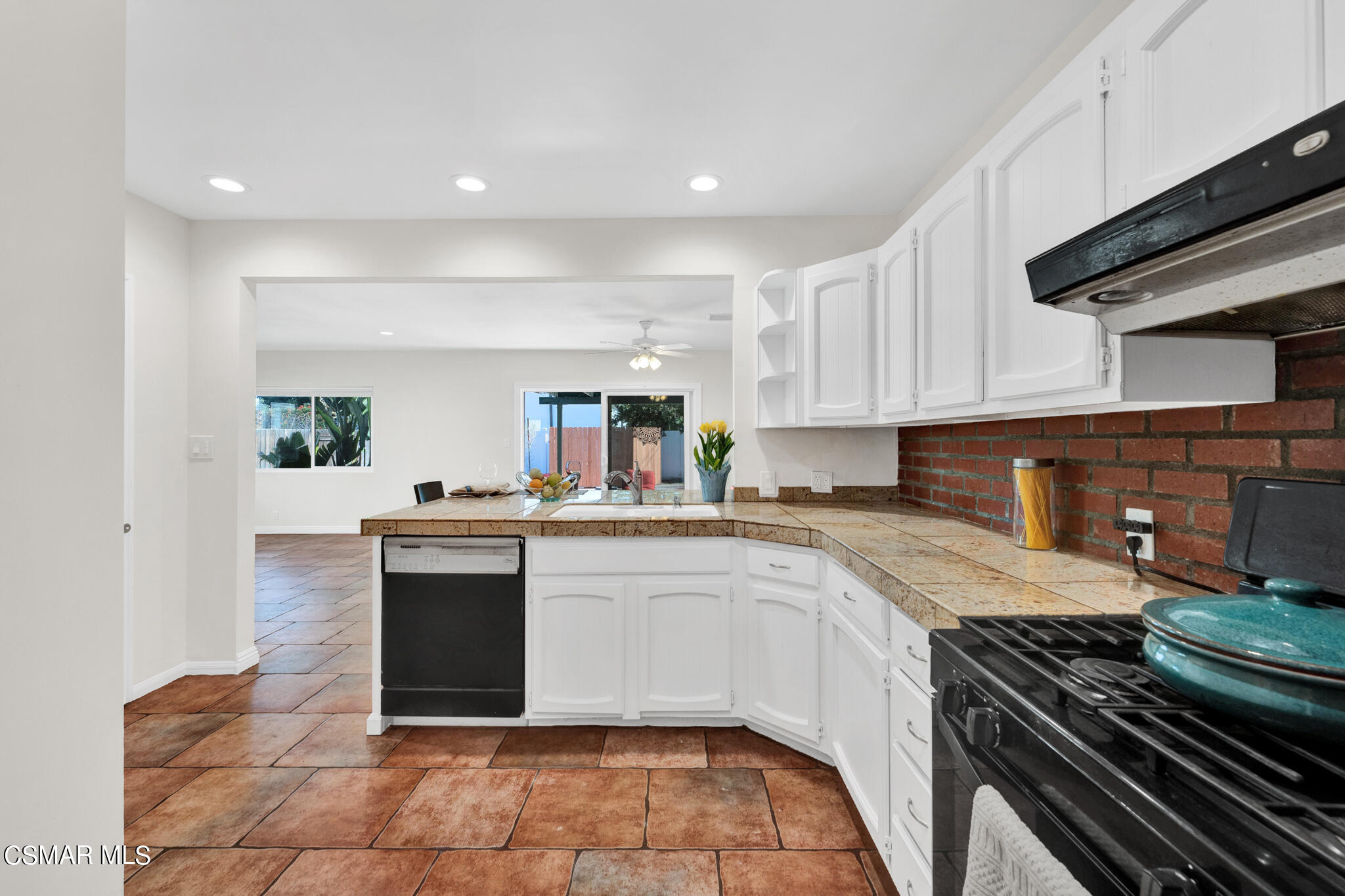 7348 Yolanda Avenue Reseda, CA 91335 - Photo 11 of 23 a kitchen with a sink stove top oven and cabinets